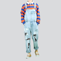 Ripped-leg painted denim jumpsuit