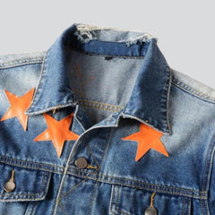 Vintage Jeansjacke mit orangenen Sternen