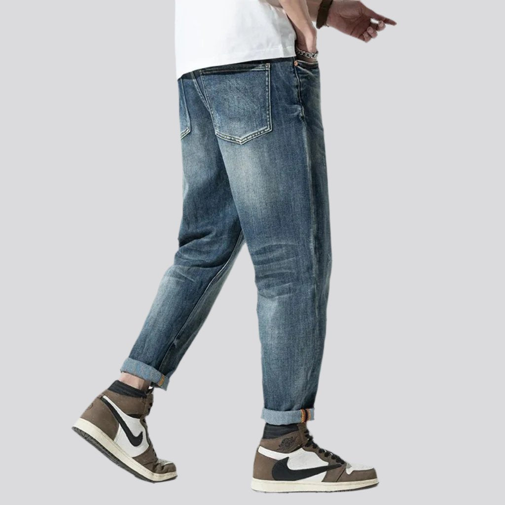 Stonewashed men whiskered jeans