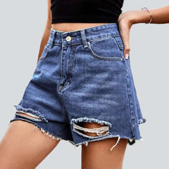 Medium wash distressed denim shorts