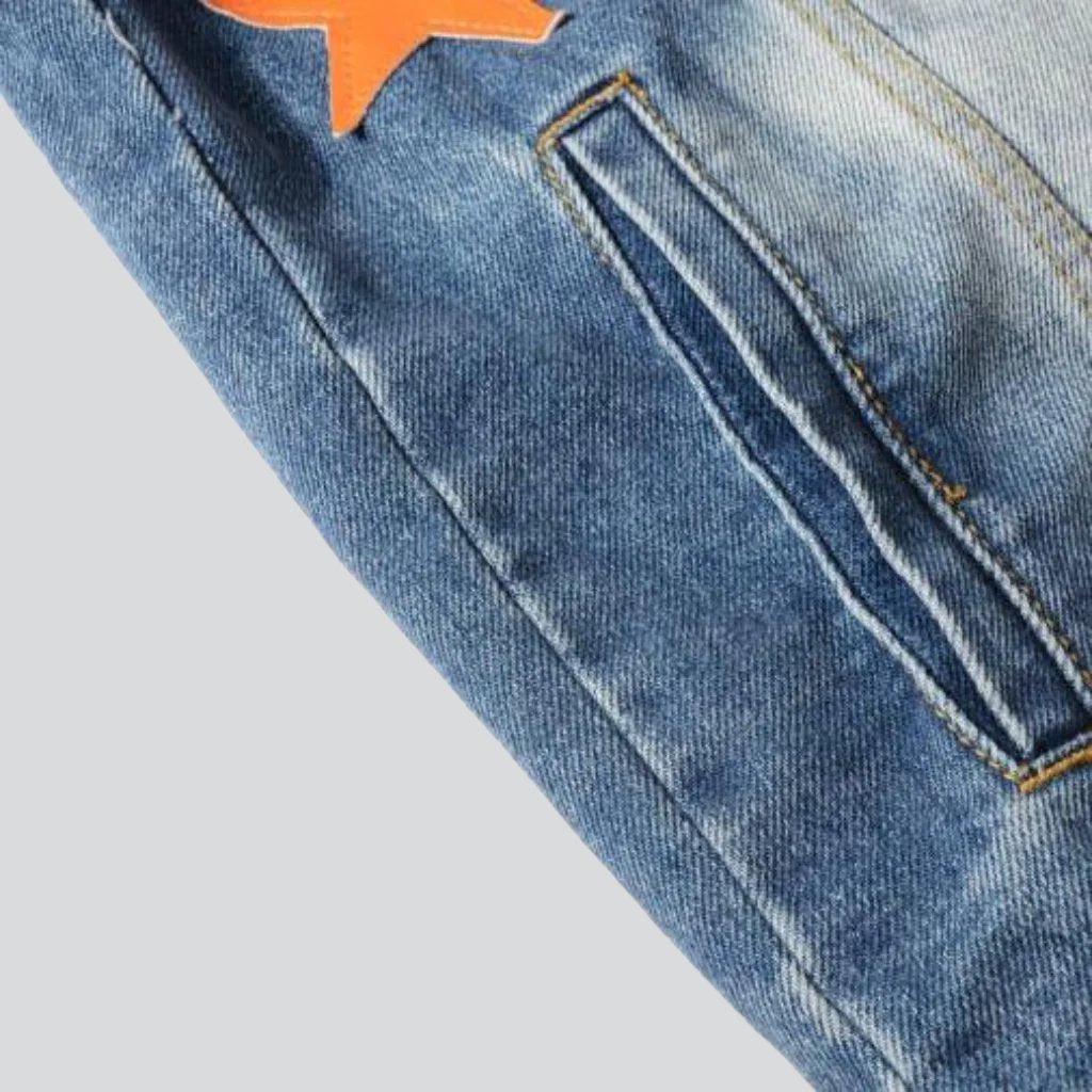 Vintage Jeansjacke mit orangenen Sternen