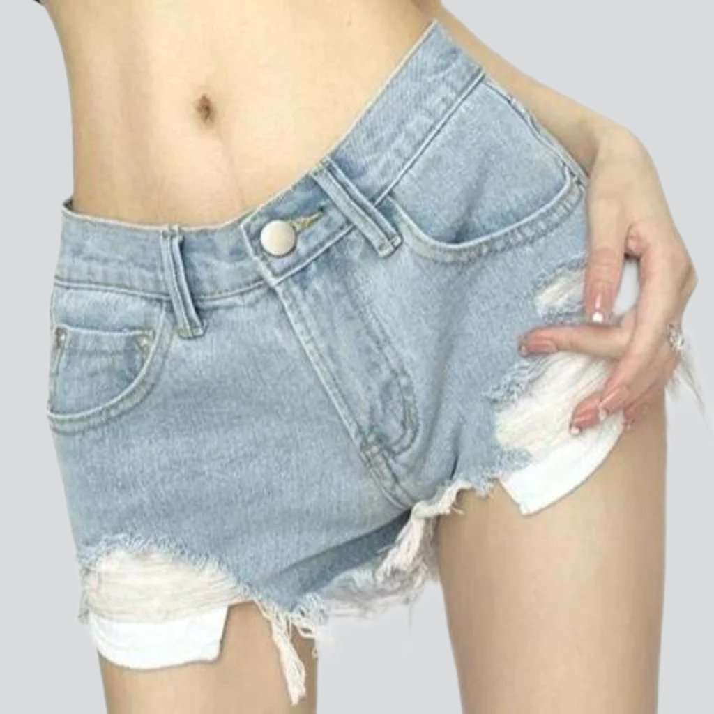 Low-rise distressed denim shorts