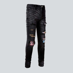 Patchwork-Bikerjeans mit Graffiti-Print