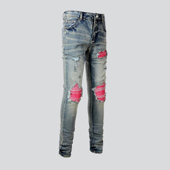 Rosa Patchwork-Jeans für Herren