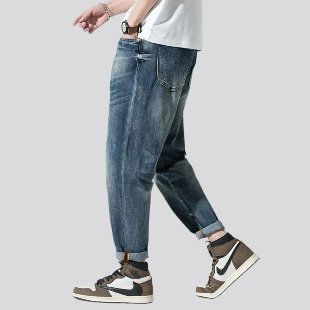 Stonewashed men whiskered jeans