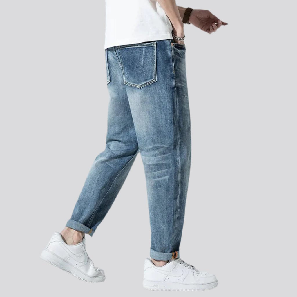 Stonewashed men whiskered jeans