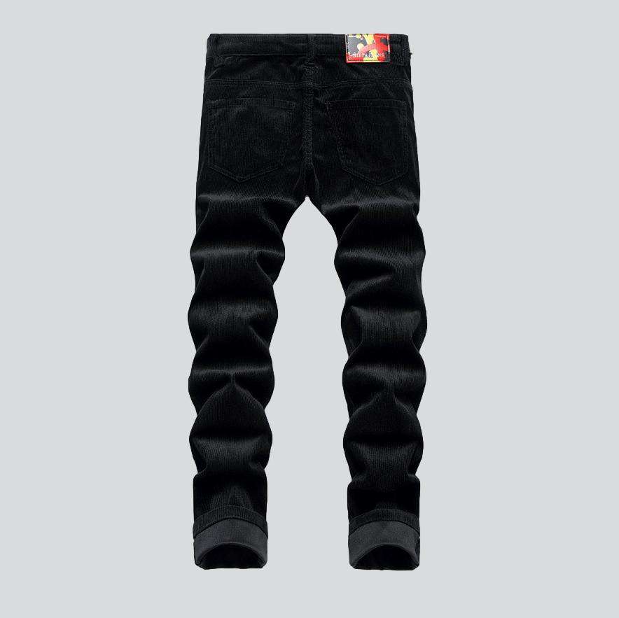 Corduroy jeans with red inscriptions