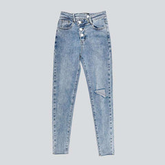 Exposed asymmetric button women jeans