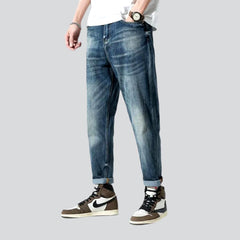 Stonewashed men whiskered jeans