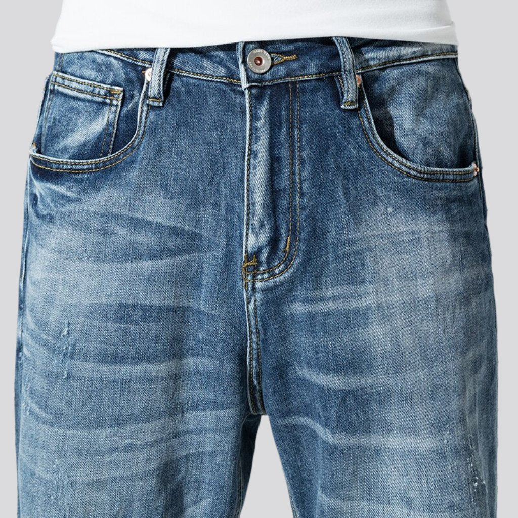 Stonewashed men whiskered jeans