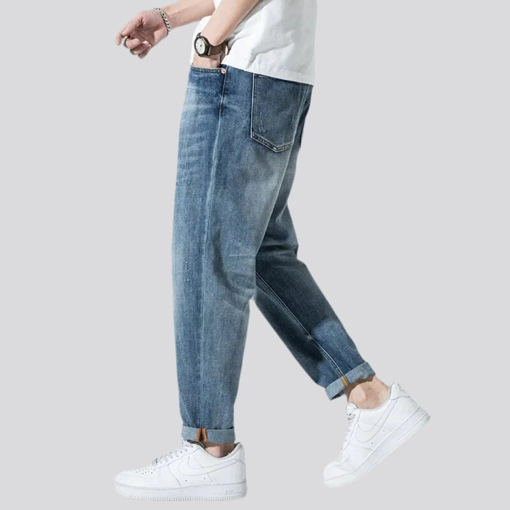 Stonewashed men whiskered jeans