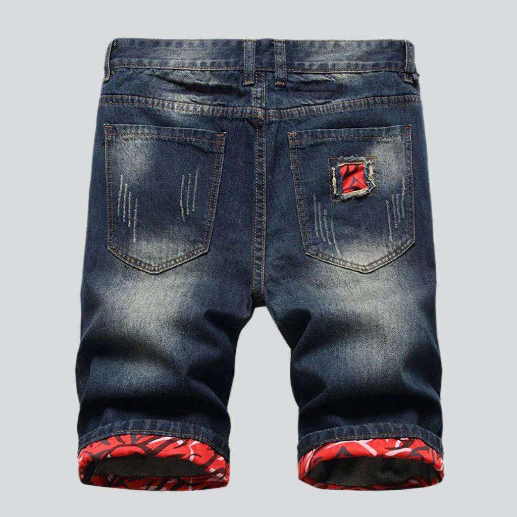 Shorts vaqueros desgastados con lavado oscuro