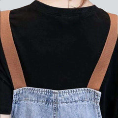 Denim dungaree with brown suspenders