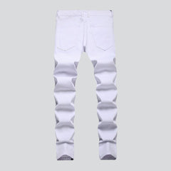 Painted white jeans with zippers