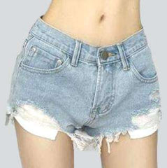 Low-rise distressed denim shorts