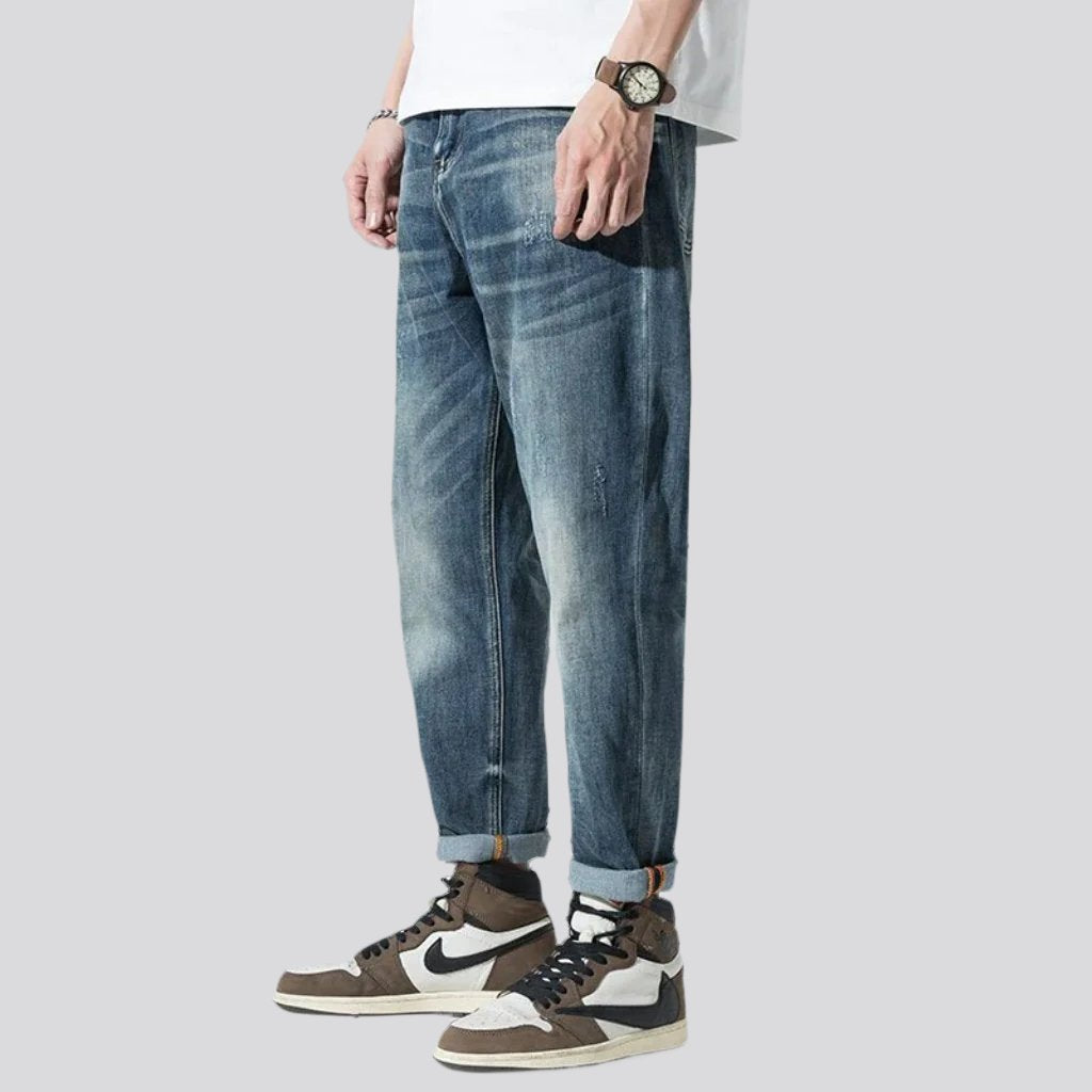 Stonewashed men whiskered jeans