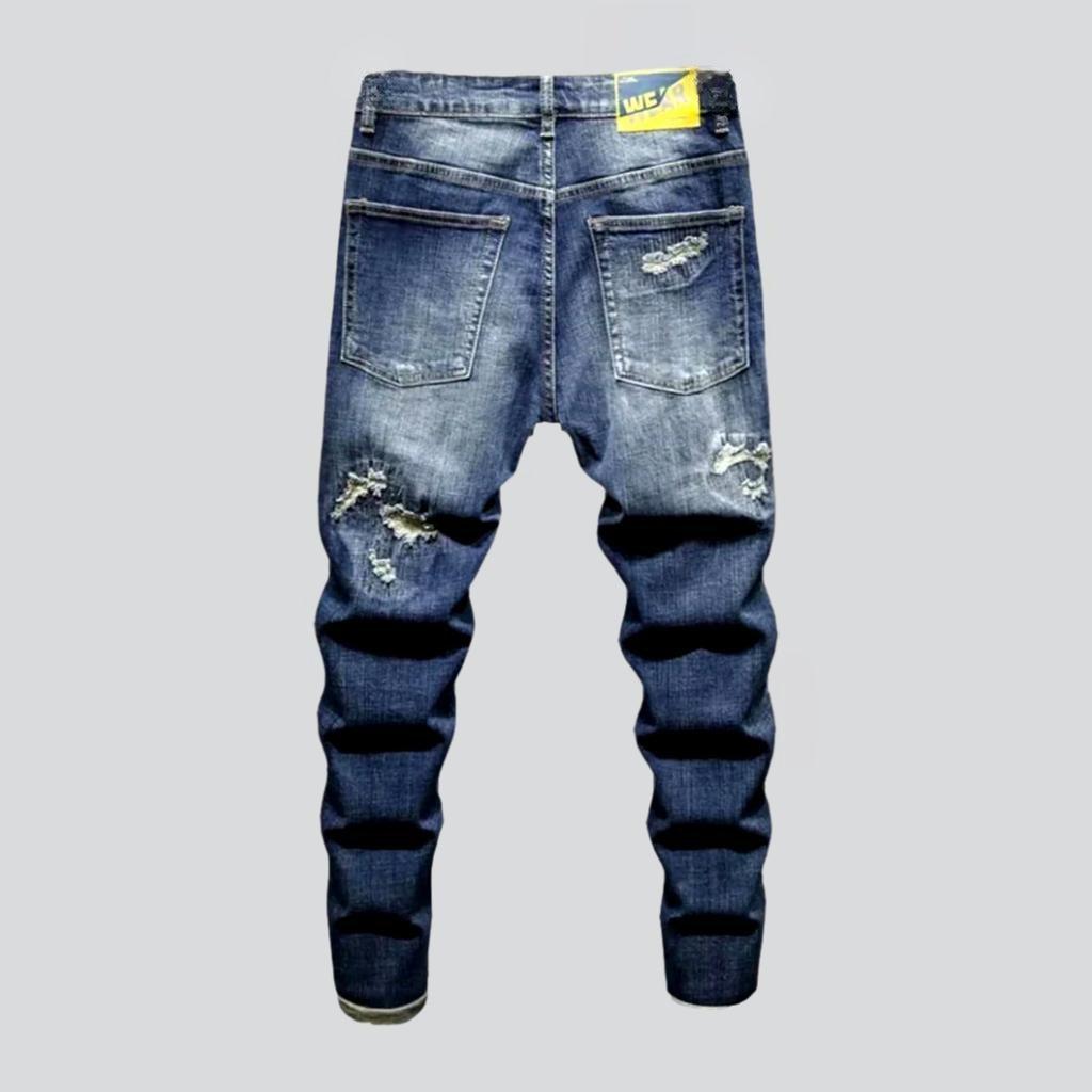 Trendy style distressed blue jeans