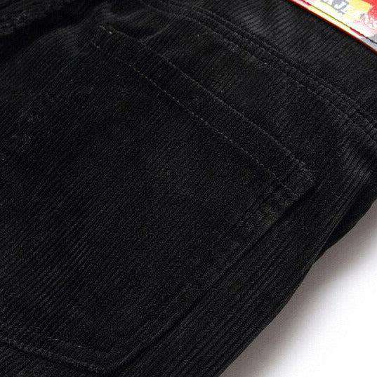 Corduroy jeans with red inscriptions