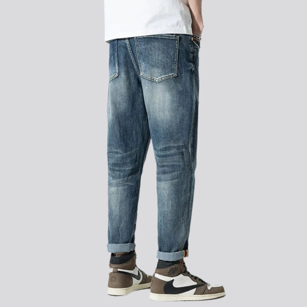 Stonewashed men whiskered jeans