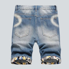 Shorts vaqueros rotos con dobladillo bordado