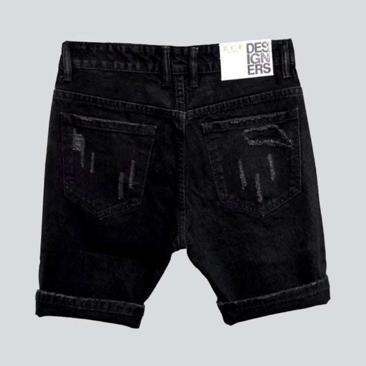 Inscribed patches distressed denim shorts