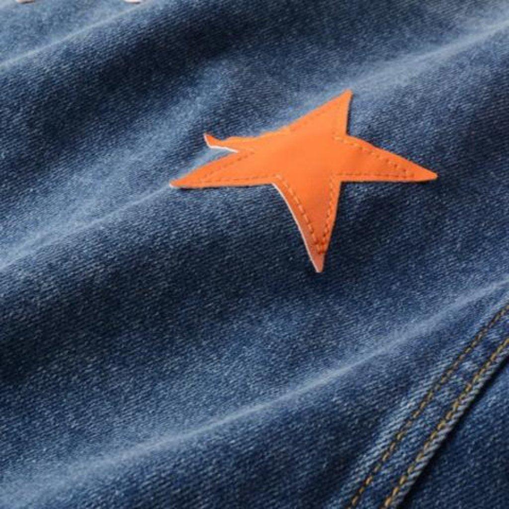 Vintage Jeansjacke mit orangenen Sternen