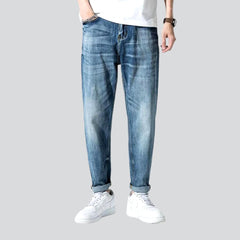 Stonewashed men whiskered jeans