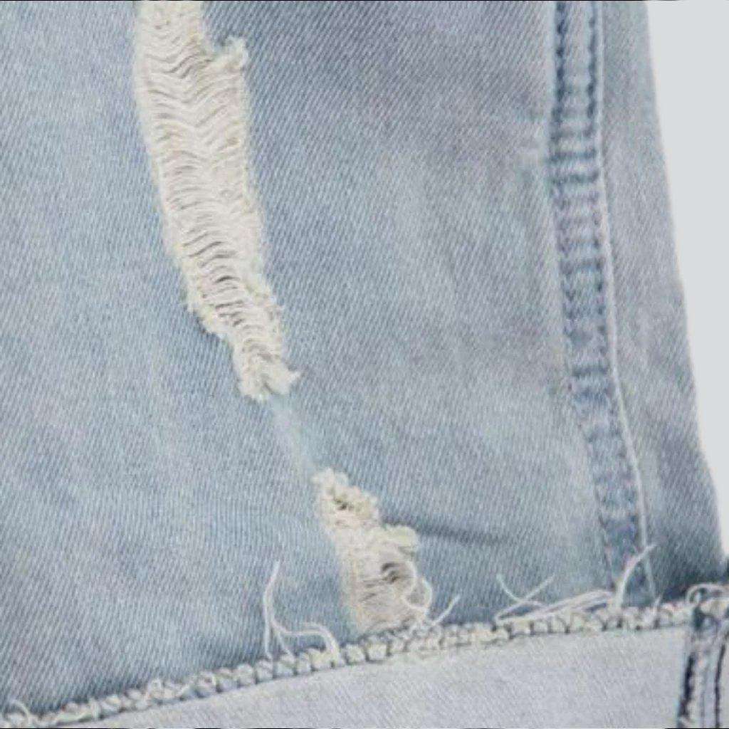 Leicht gewaschener, zerrissener Jeans-Strampler