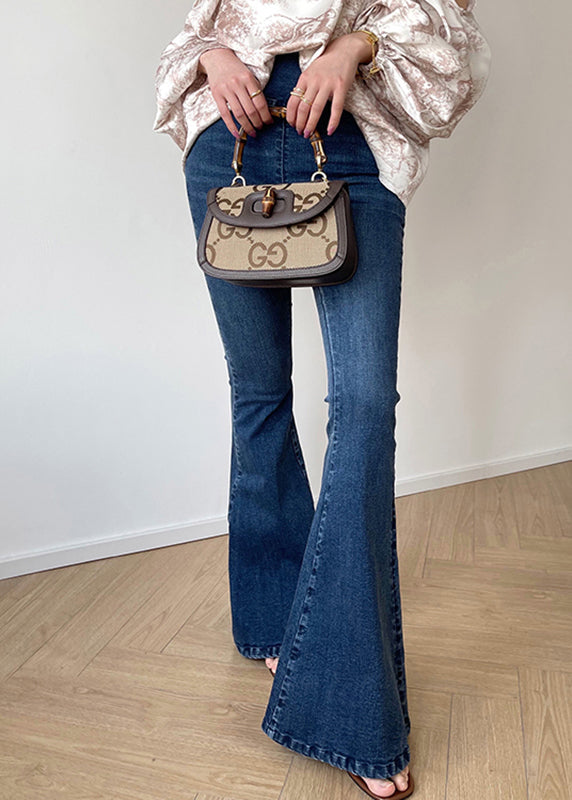 Pantalones acampanados de mezclilla azul vintage con bolsillos de cintura alta y cremallera para otoño