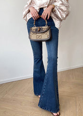 Pantalones acampanados de mezclilla azul vintage con bolsillos de cintura alta y cremallera para otoño