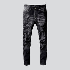 Whiskered distressed black men jeans