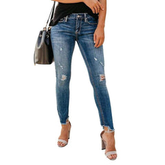 Distressed women skinny jeans