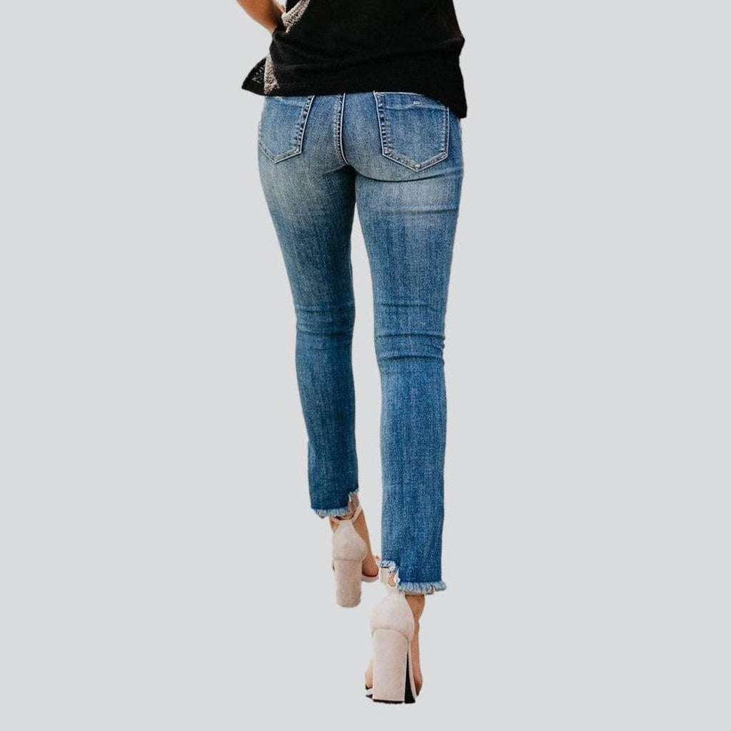 Distressed women skinny jeans