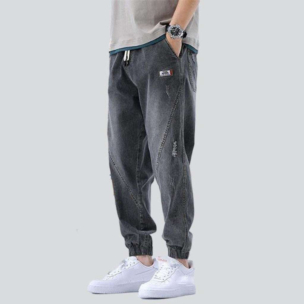 Loose men jeans with straps